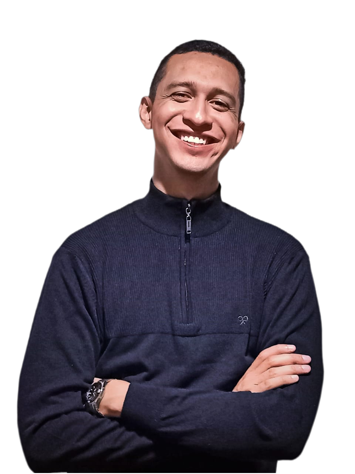Jesús Valenzuela smiling with his arms crossed
